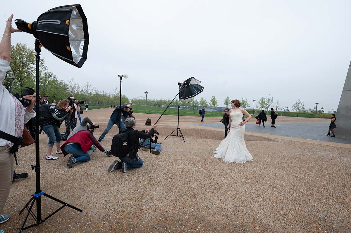 photography conference model in a bridal gown at the St. Louis arch
